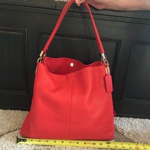 Authentic Coach Lexy purse. Red-orange color